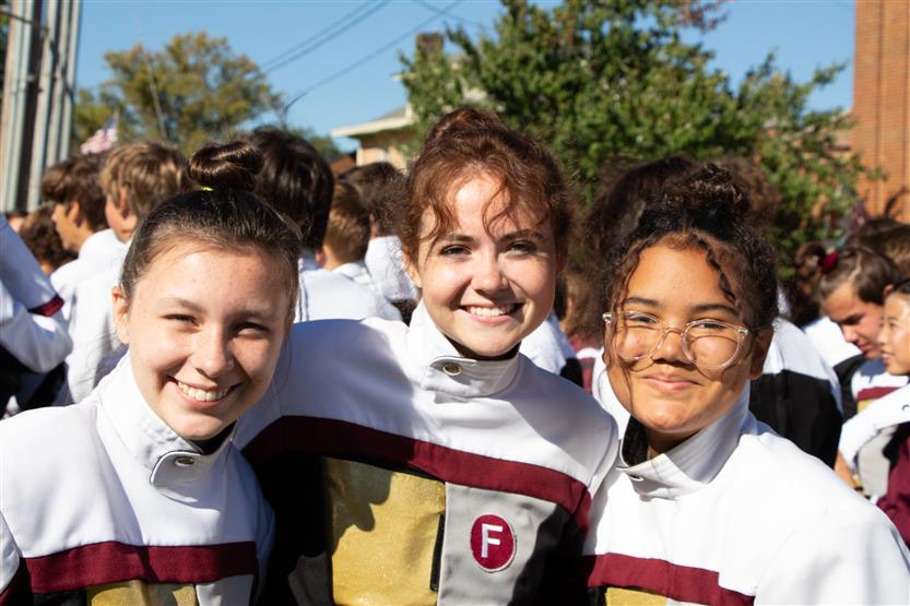 Three girls smile
